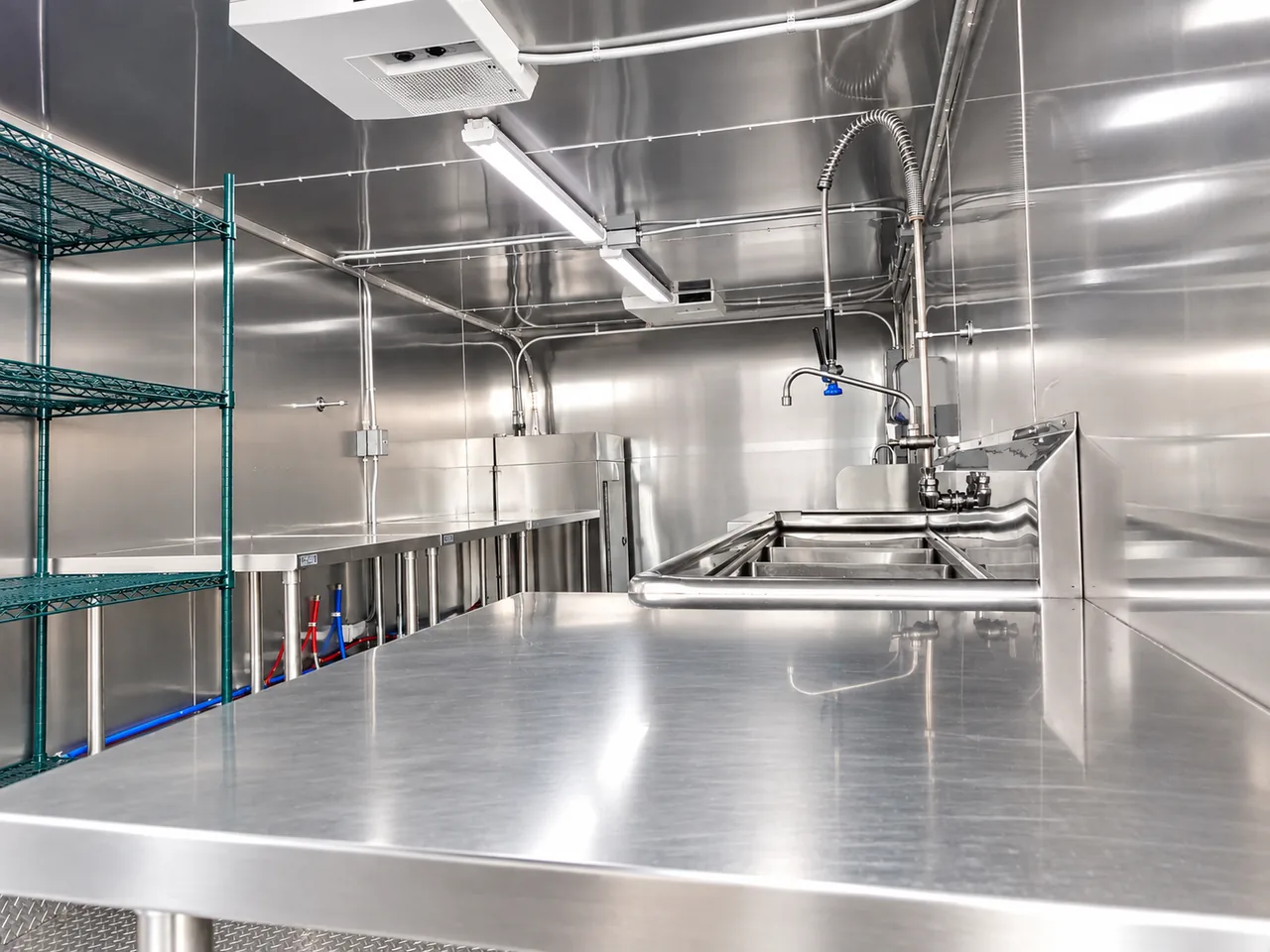 Stainless workstation inside a low-temperature commercial dish trailer