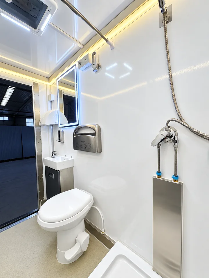 Interior of a three-stall plus one ADA luxury shower-restroom trailer
