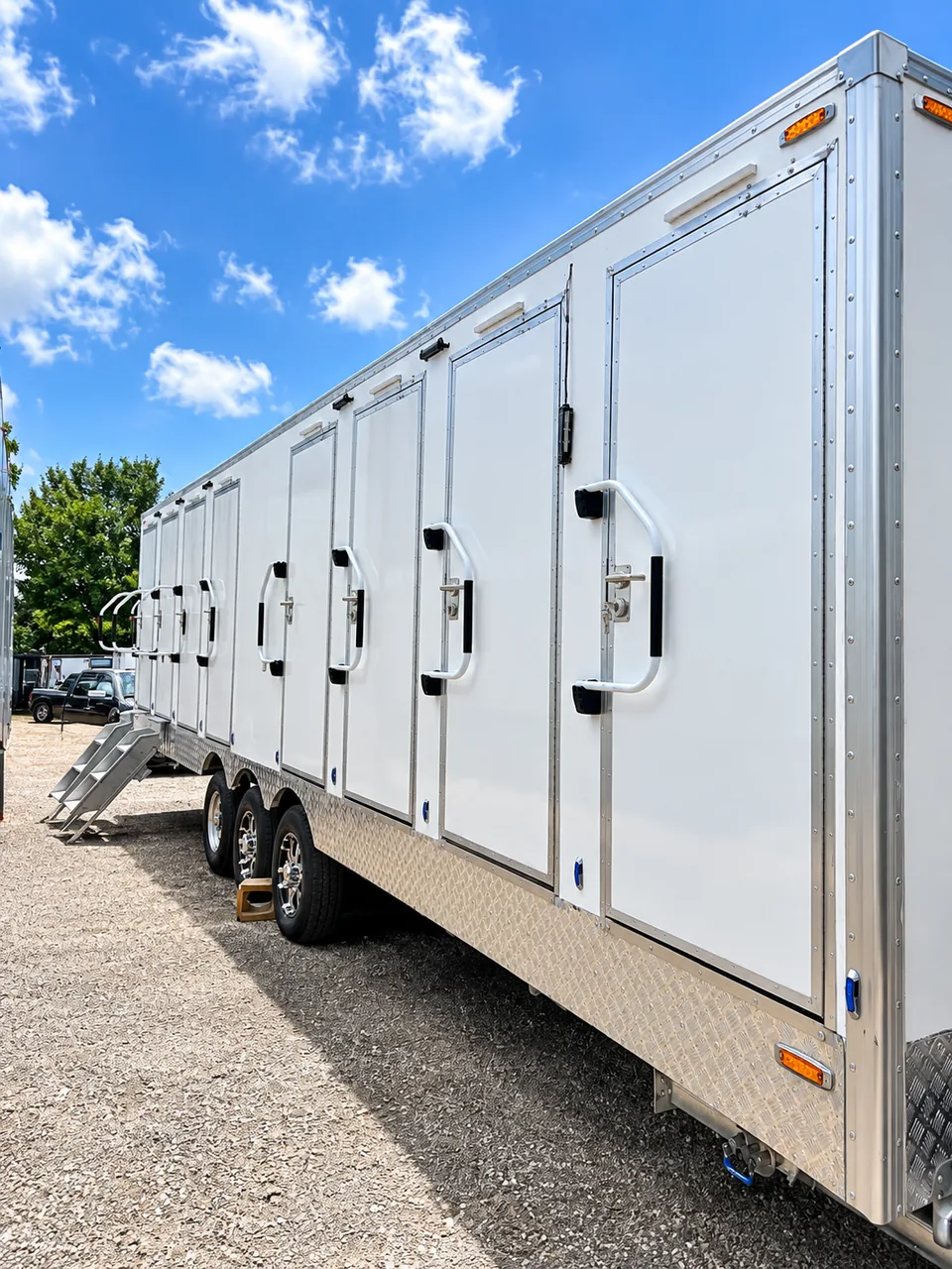 Mobile shower and restroom combination trailer for temporary workforce housing