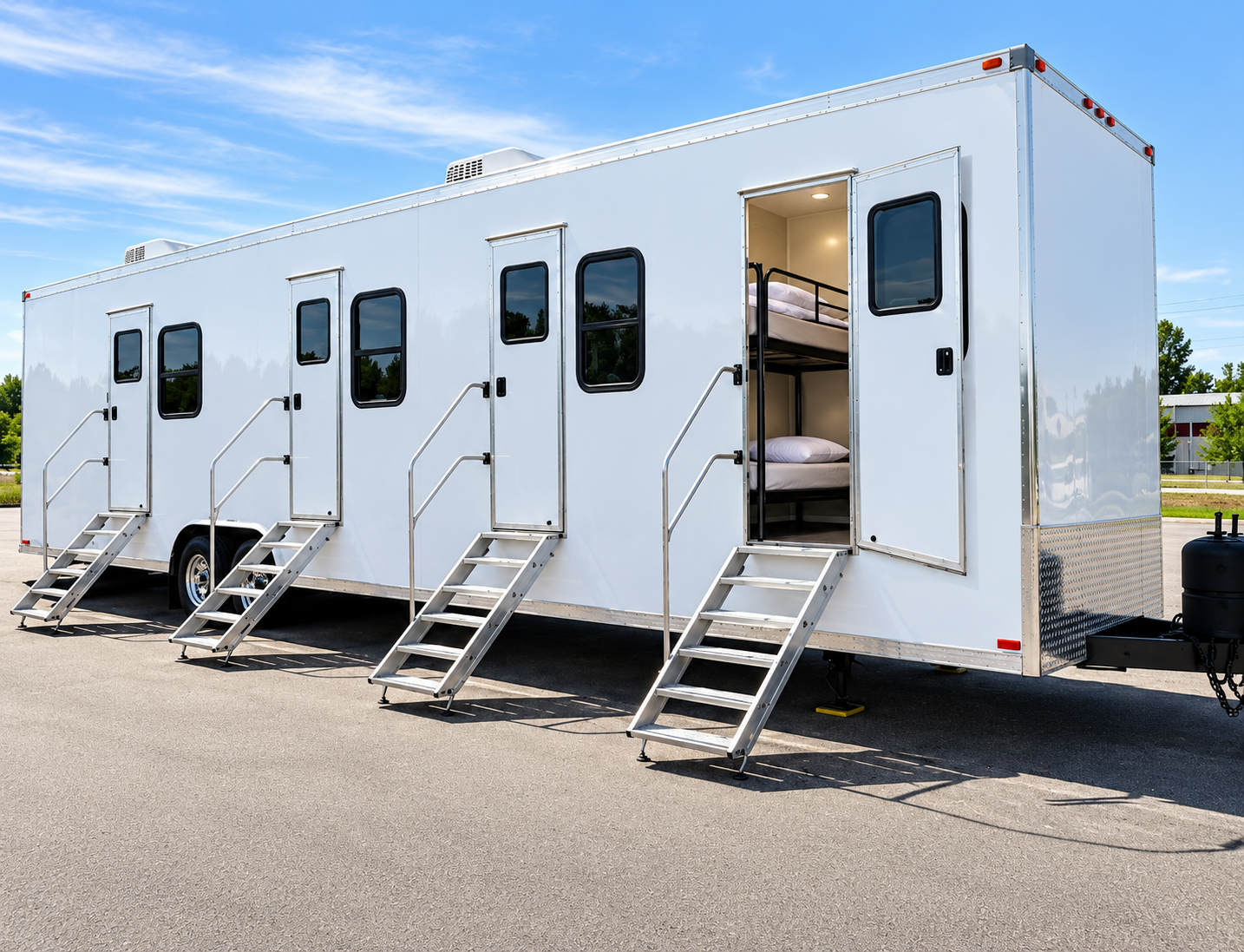 Portable sleeper accommodation trailer exterior with multiple private entrances and visible bunkbeds